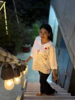 White Embroidered Tunic Top with Black Pants - Image 4